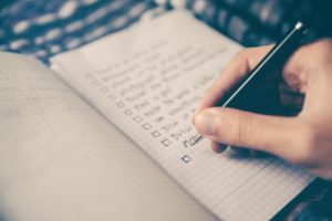 This is a picture of someone creating a written list.